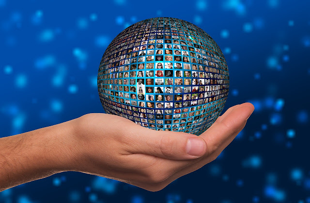 a hand holding  the globe with the nations